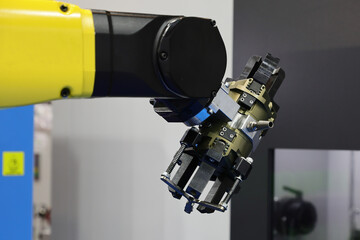 A robotic arm is presented at a technology and innovation fair.