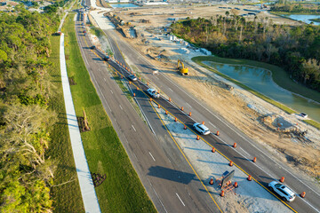 Aerial view of busy American highway road under construction. Development of traffic...
