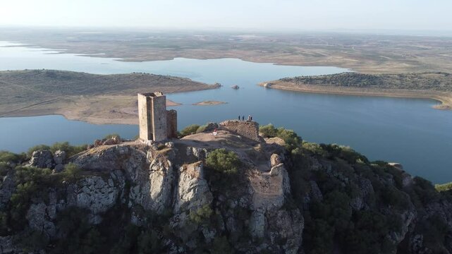 Aerial view of the ruins of Castillo de Alange in Extremadura, Spain, perched on a rocky hilltop