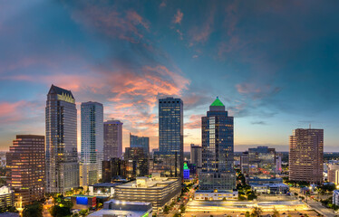 Downtown district of Tampa city in Florida, USA after sunset. Brightly illuminated high buildings...