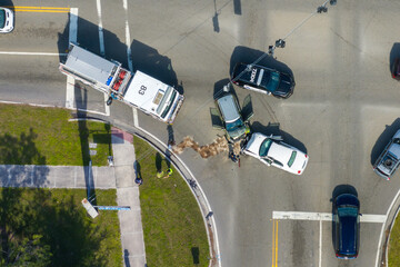 First responders at car accident site in Florida. Emergency services personnel helping victims of...