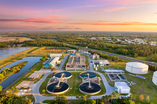 Large-scale industrial water treatment plant purifying and recycling water through filtration and chemical processes to meet health and safety standards