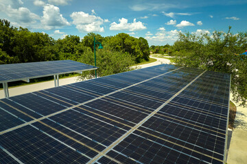 Solar panels installed over parking lot for parked cars for effective generation of clean energy