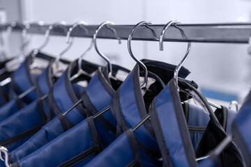 A rack of lead aprons used for protection from Xray, x-ray, x ray beam in operating room or dentist...