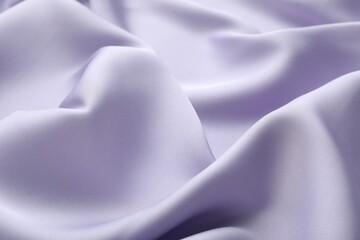 Crumpled violet silk fabric as background, closeup