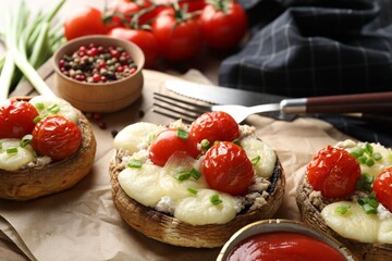Tasty stuffed mushrooms served on table, closeup