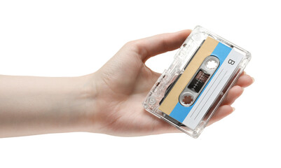 Woman holding audio cassette with blank label on white background, closeup