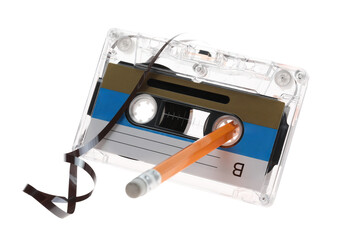Rewinding audio cassette with pencil isolated on white