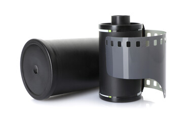 Roll of photographic film and canister isolated on white