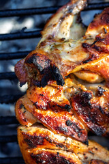 Pork chops, steak, sausages on barbecue grill