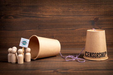 Internet Censorship Concept with Paper Cups, Wooden Figures on Brown Background
