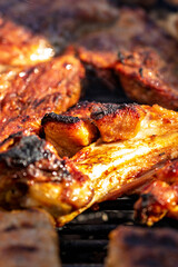 Pork chops, steak, sausages on barbecue grill