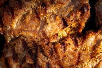 Pork chops, steak, sausages on barbecue grill