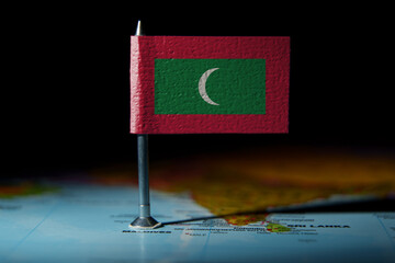 Small Maldives flag pinned on map, highlighting the island nation location in the Indian Ocean