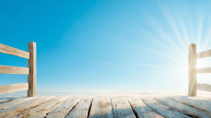 Naklejka premium A wooden pier stretches out into a vast, calm expanse under a clear blue sky. The sun rises gently, casting warm rays that illuminate the scene, creating a peaceful atmosphere
