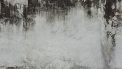 The old gray cement wall is stained, peeled, and has a peeling surface. The wall has been stained...