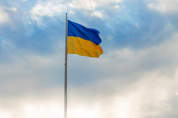 Ukrainian waving flag independence day wallpaper concept poster with light glare empty copy space...