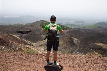 hiker trekking on mount Etna