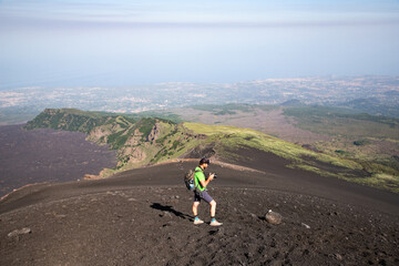 hiker trekking on mount Etna