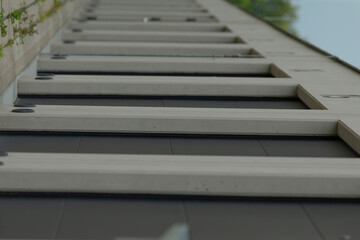 Fototapeta premium There is a row of stairs located on the side of a tall building, creating an architectural feature that enhances accessibility