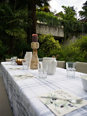 Serene garden scenery in the evening, with set table ready for dinner.