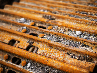 The rusty tracks of a machine are shown in the image. The tracks are old and worn, and the machine is likely a tractor or excavator. Heavy machinery equipment and tools.