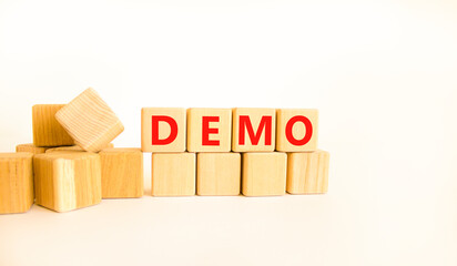 Demo symbol. Concept word Demo on beautiful wooden blocks. Beautiful white table white background....