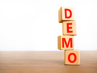 Demo symbol. Concept word Demo on beautiful wooden blocks. Beautiful wooden table white background....