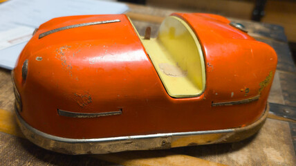 old bumper car toy vinage whimsical orange yellow vintage nostalgic game playful ride