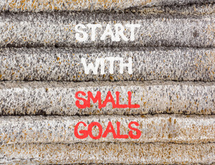 Start with small goals symbol. Concept words phrase Start with small goals on beautiful grey stone...