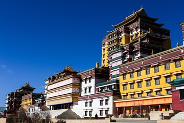Colorful facade of Gomang Monastery near Ngawa in the Amdo region, showcasing traditional Tibetan...