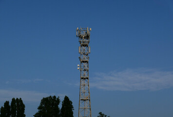 Obraz premium communication tower mast over blue sky