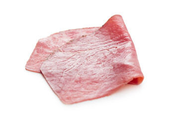 Sliced beef pastrami isolated on white background.