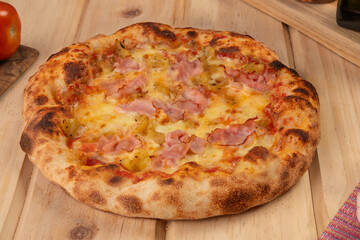 Pizza with ham, curry pineapple and cheese
