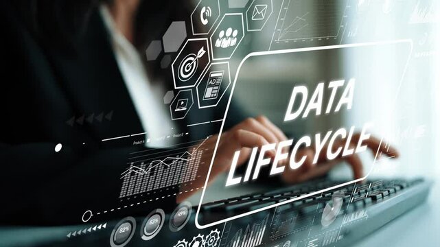 Professional analyzing data lifecycle trends with digital interface and financial graphs in modern office environment. Asymptotic smart data analytic. - Powered by Adobe