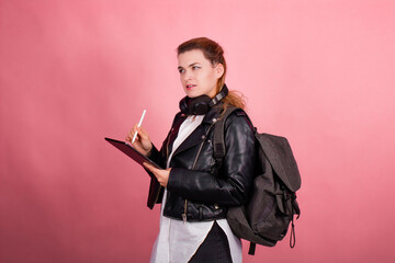 Woman with headphones, listening to music, fashion model in studio posing, music genre, smiling, rock, metal music , tablet