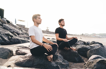 Coders in seated meditation on cliff simulate CPU idle state, optimizing brain cycles, mindfulness...