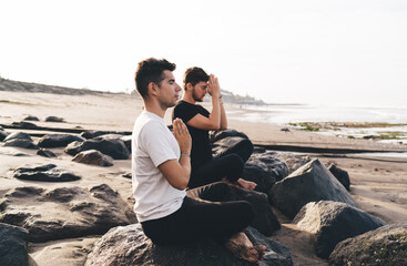 Pair of mindful users synchronizing breath and posture as wireless data handshake, enabling...