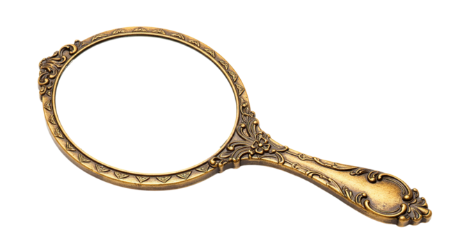 An antique gold hand mirror with ornate floral design on a black background.