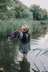 In combination with nature and flowers, harmony with oneself, happy moments, peace and balance. A charming girl in nature.