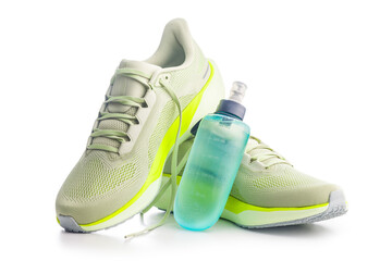 Sport running shoes and water bottle  isolated on white background.