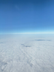 Fototapeta premium Aerial view of cloudscape meeting blue sky on sunny day
