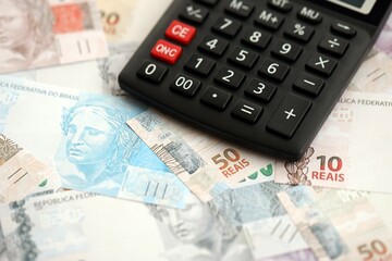 Brazilian reais banknotes and calculator. The current Brazil real money bills and calculator
