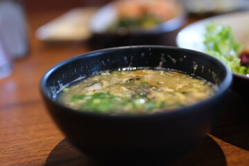 egg soup Chinese cabbage with chopped pork soup on bamboo tray