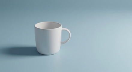 Fototapeta premium Simple Elegance: A clean, pristine white mug stands isolated on a soft blue surface. The minimalistic composition highlights the mug's form and invites a sense of calm.