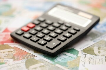 Pakistan rupees banknotes and calculator. The current Pakistan money bills with calculator
