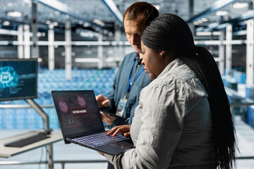 Server hub colleagues using AI to detect abnormal network traffic patterns caused by hacker attack....