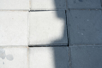 Uneven Pavement Tiles with Cracks and Shadows