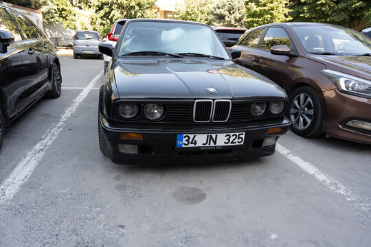 Classic Black BMW E30 Parked in an Outdoor Lot