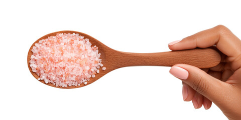 Wooden spoon of Himalayan pink salt crystals in hand